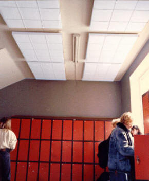 Sonett absorber in cage mounted in ceiling